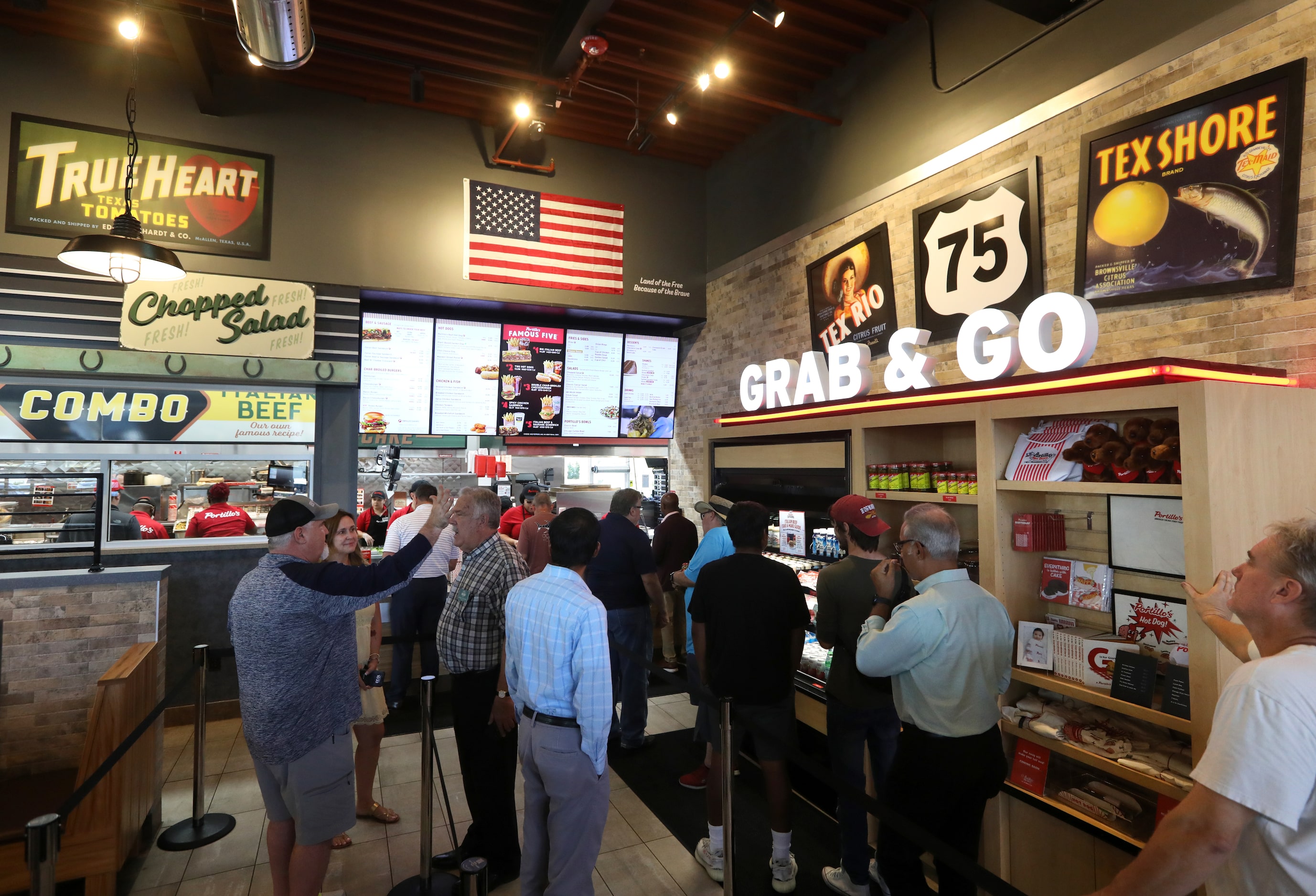 Guests wait in line to order at Portillo's in Allen.