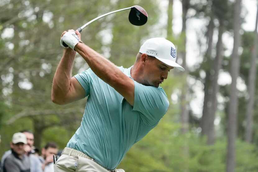 Bryson DeChambeau hits from the seventh tee during a practice for the Masters golf...