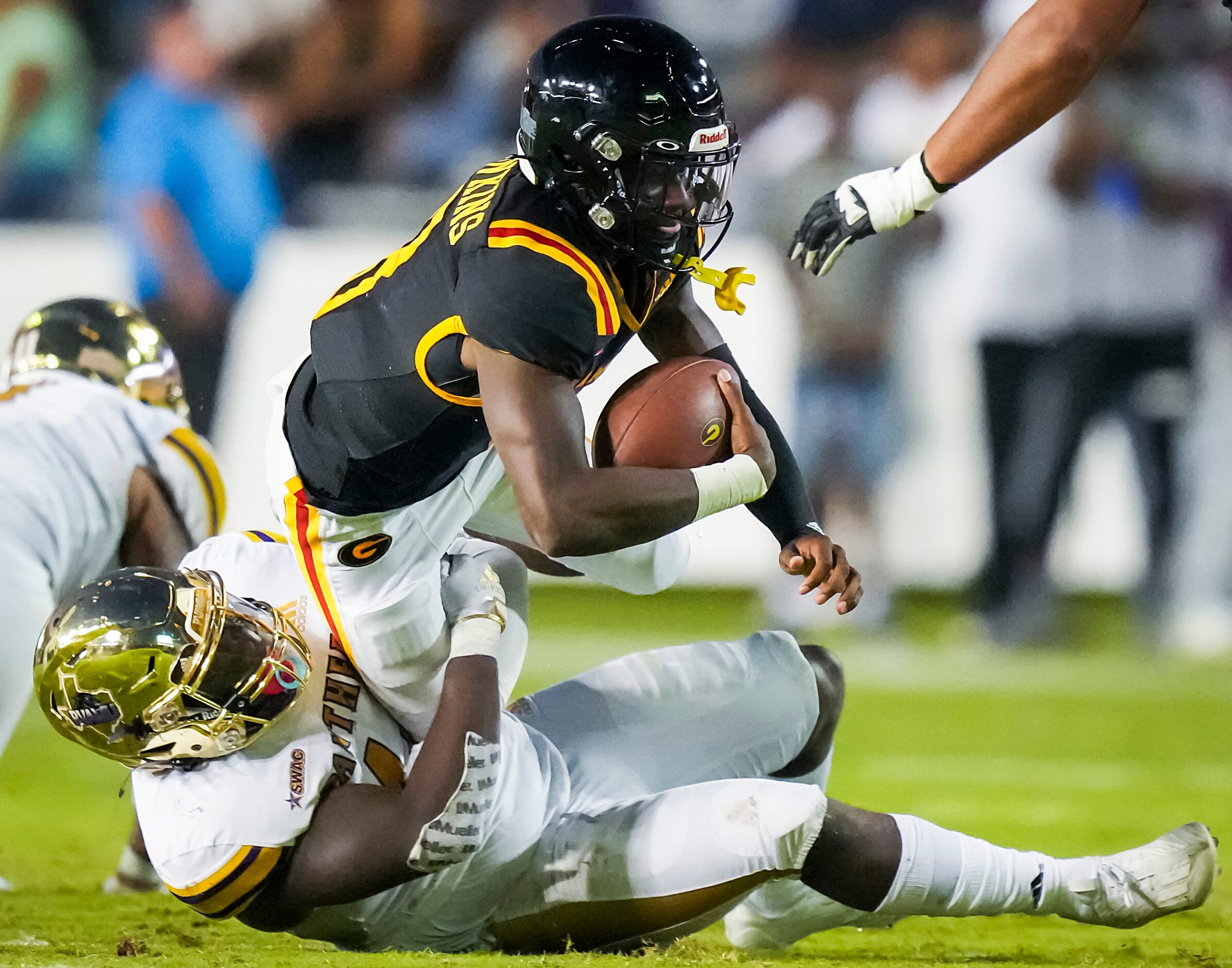 Grambling quarterback Quaterius Hawkins (8) is sacked by Prairie View linebacker Warren...