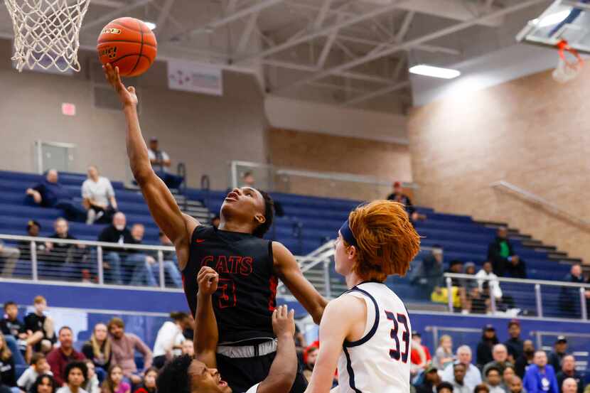 Lake Highlands senior Quinton Perkins (3) attempts a two-point basket during the...