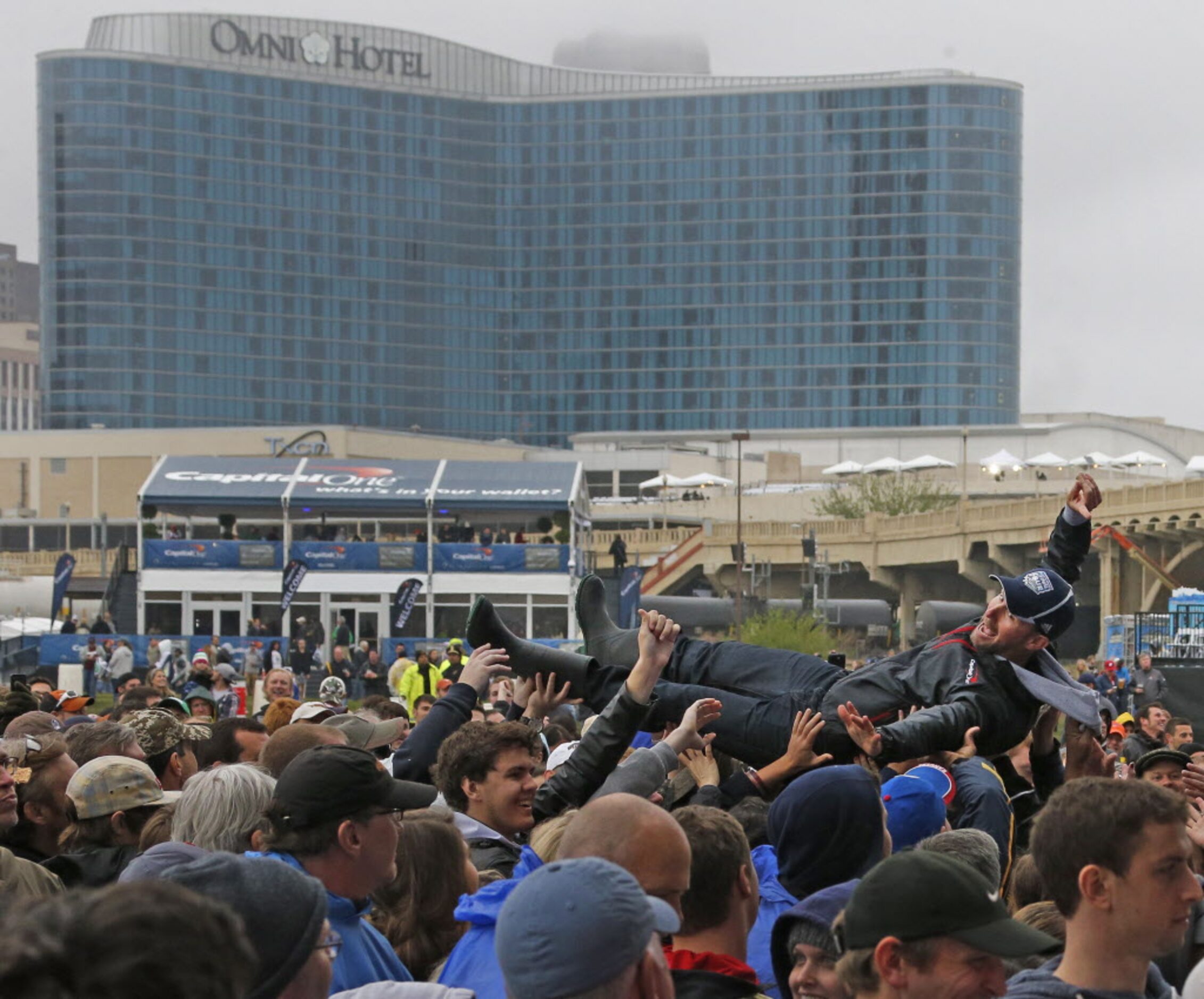 The wet weather didn't dampen the spirits of this crowd surfer before the band Fun. performs...