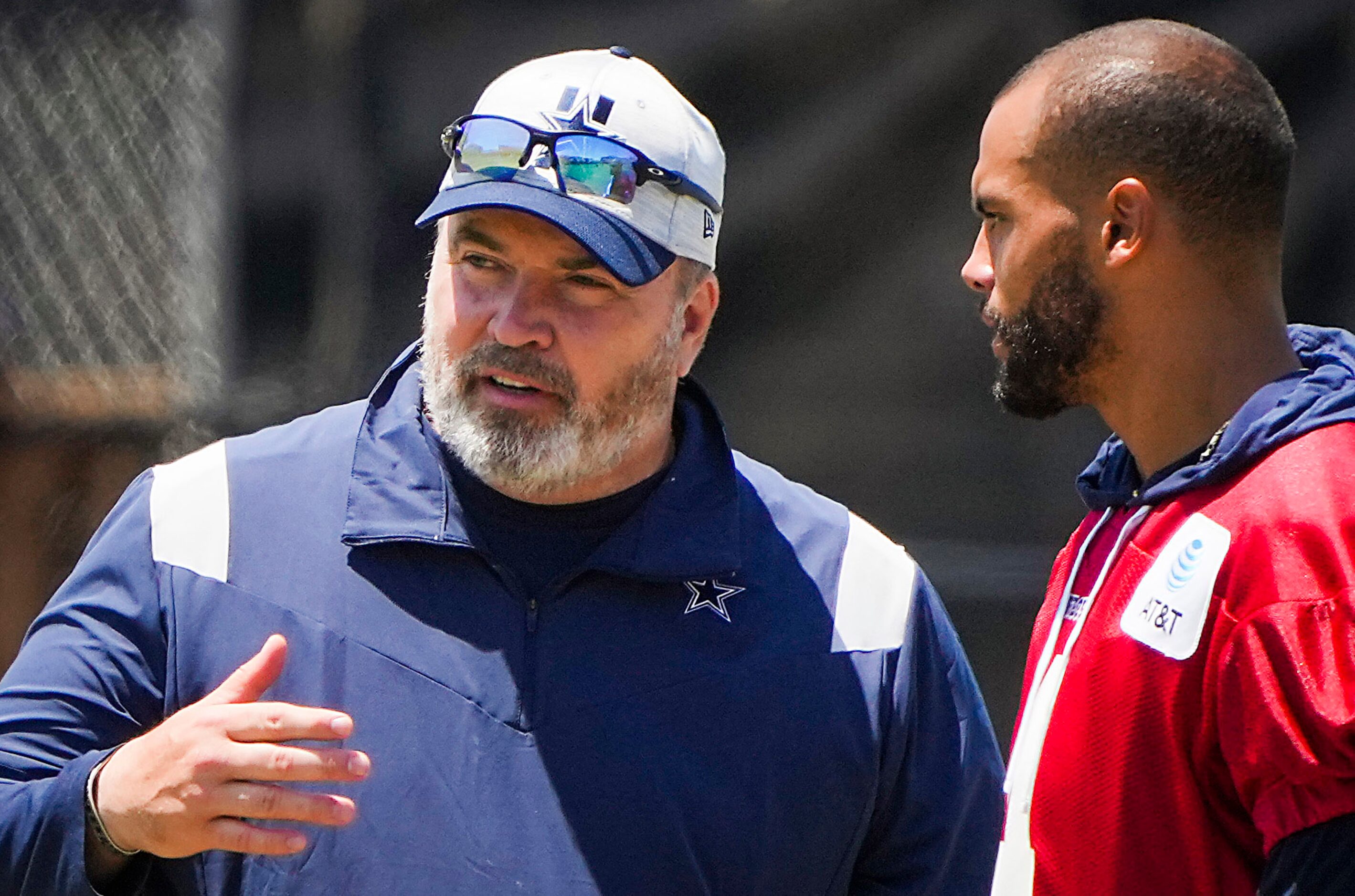 Dallas Cowboys head coach Mike McCarthy talks with quarterback Dak Prescott following a...