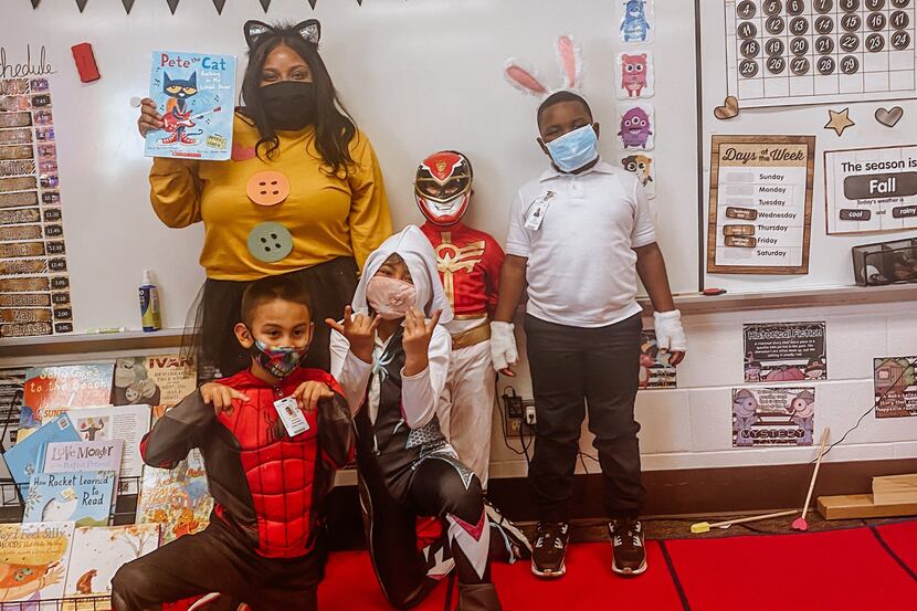 Chrishae Powell poses with in-person students on Storybook Character Day. The first-year...