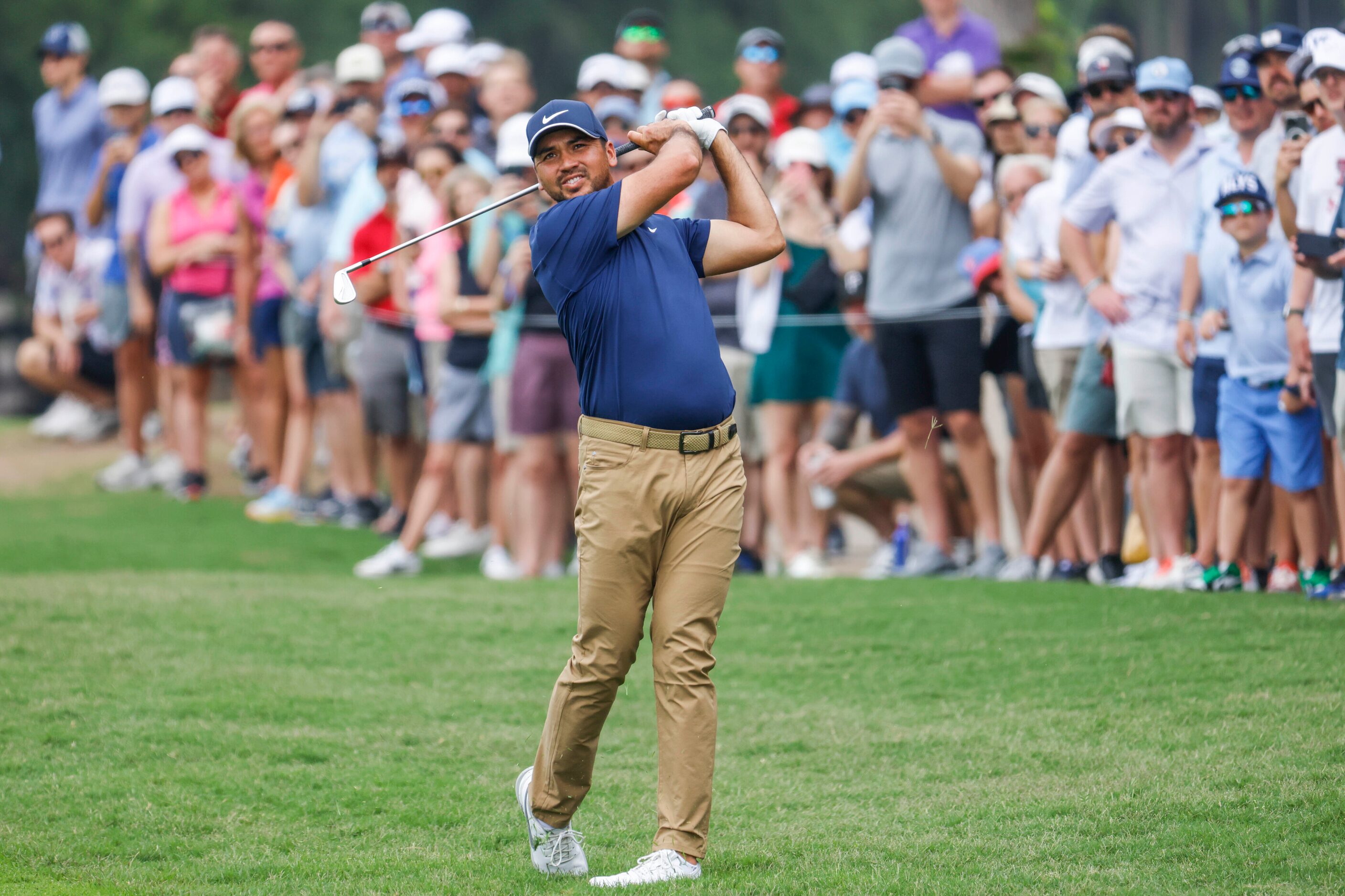 Jason Day watches as he hits on the green of the ninth hole during the second round of the...