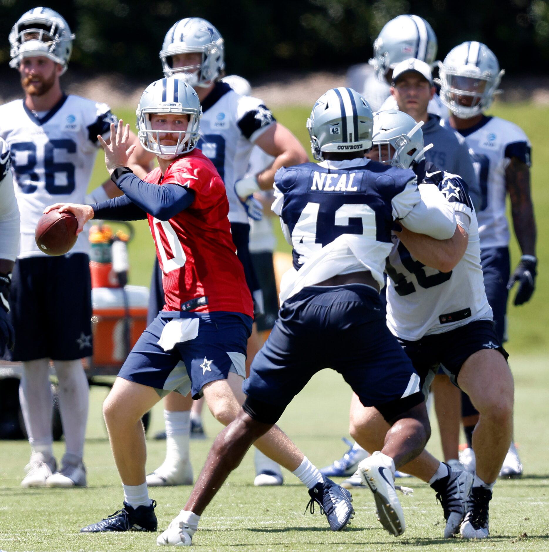 Dallas Cowboys quarterback Cooper Rush (10) throws a pass during a Training Camp practice...