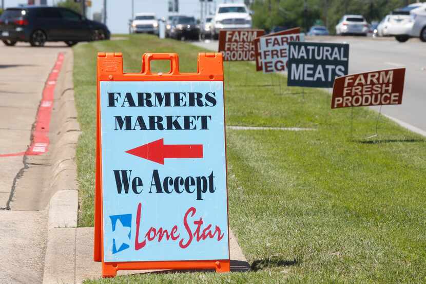 Signs along Garland Road points the way to the White Rock Lake Farmers Market