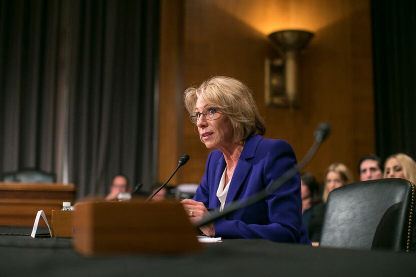 FILE -- Betsy DeVos, President Donald Trumpâs pick for Education Secretary, testifies at...