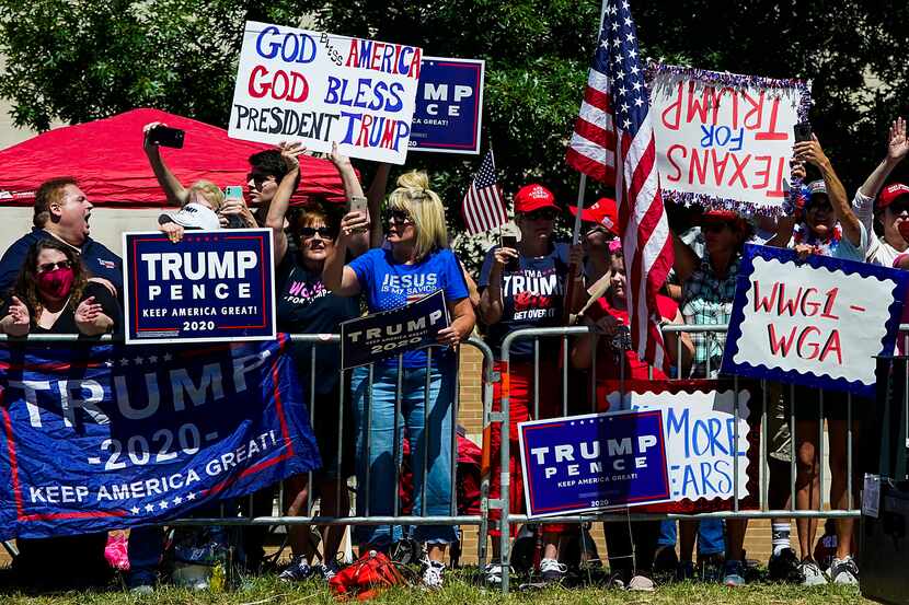 Supporters gather on the road near the church as President Donald TrumpÕs motorcade moves...