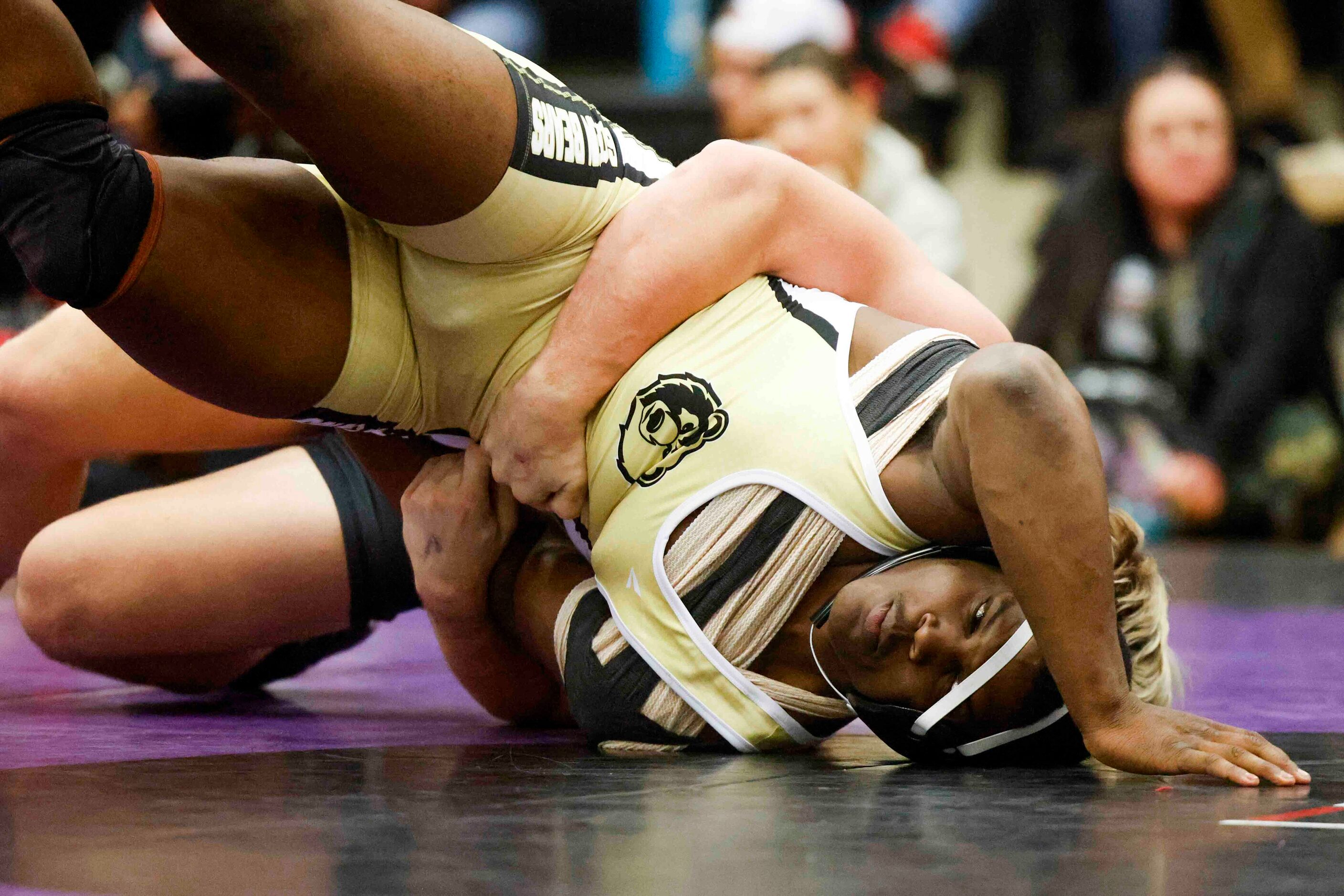 Markeist Wright of Dallas South Oak Cliff (front) wrestles with Anthony Fulmer of Winnsboro...