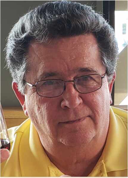 A current photo of Scott Smith, wearing glasses and a yellow shirt.