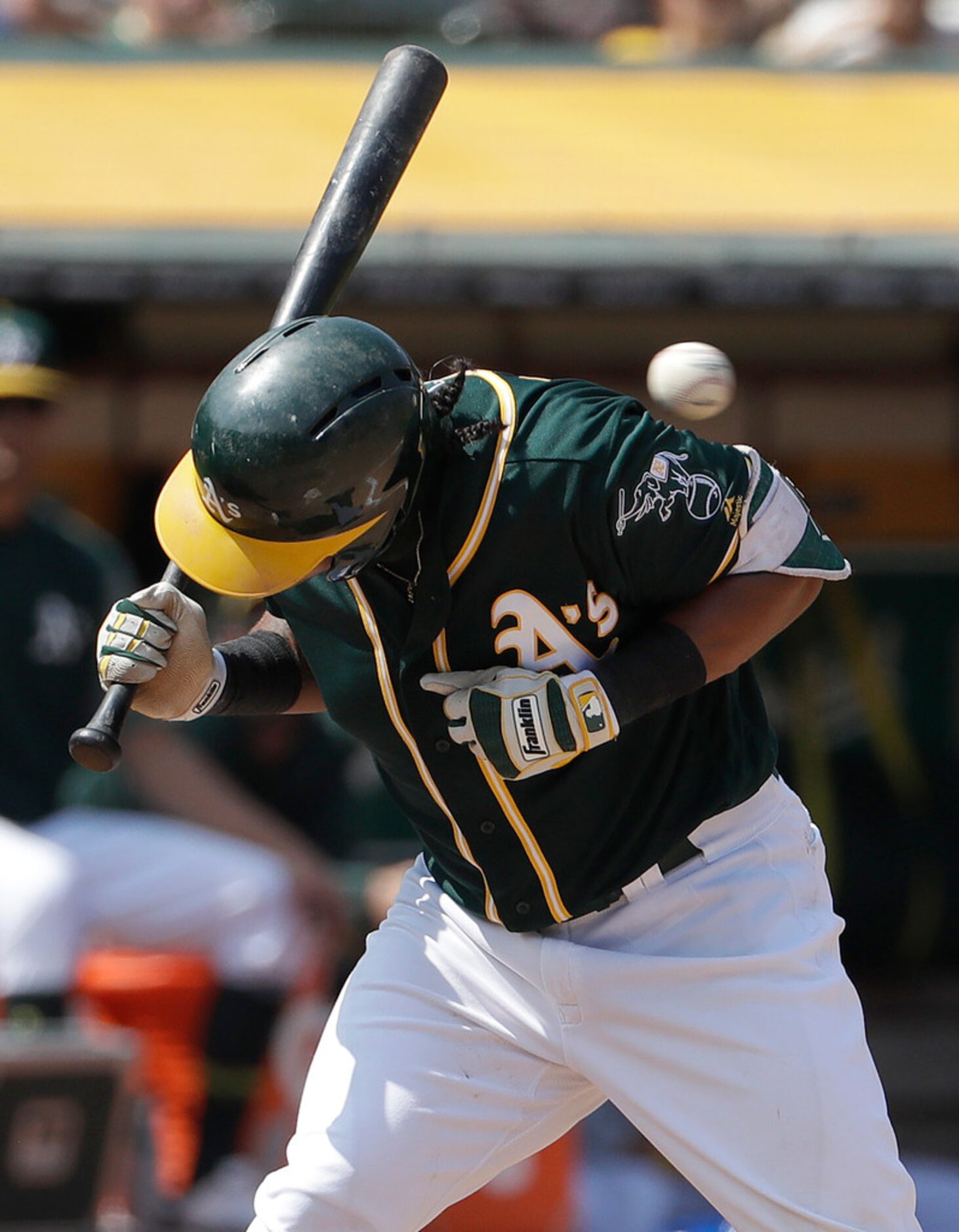 Oakland Athletics' Khris Davis is hit by a pitch from Texas Rangers pitcher Cory Gearrin...