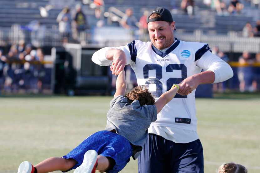 Dallas Cowboys tight end Jason Witten (82) plays with his son Cooper Witten after practice...