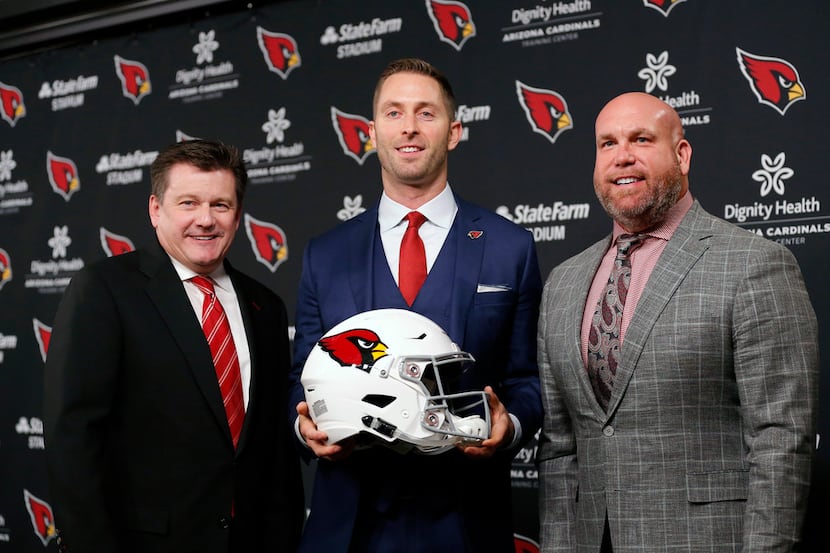 The Arizona Cardinals owner Michael Bidwell, left, head coach Kliff Kingsbury, middle, and...