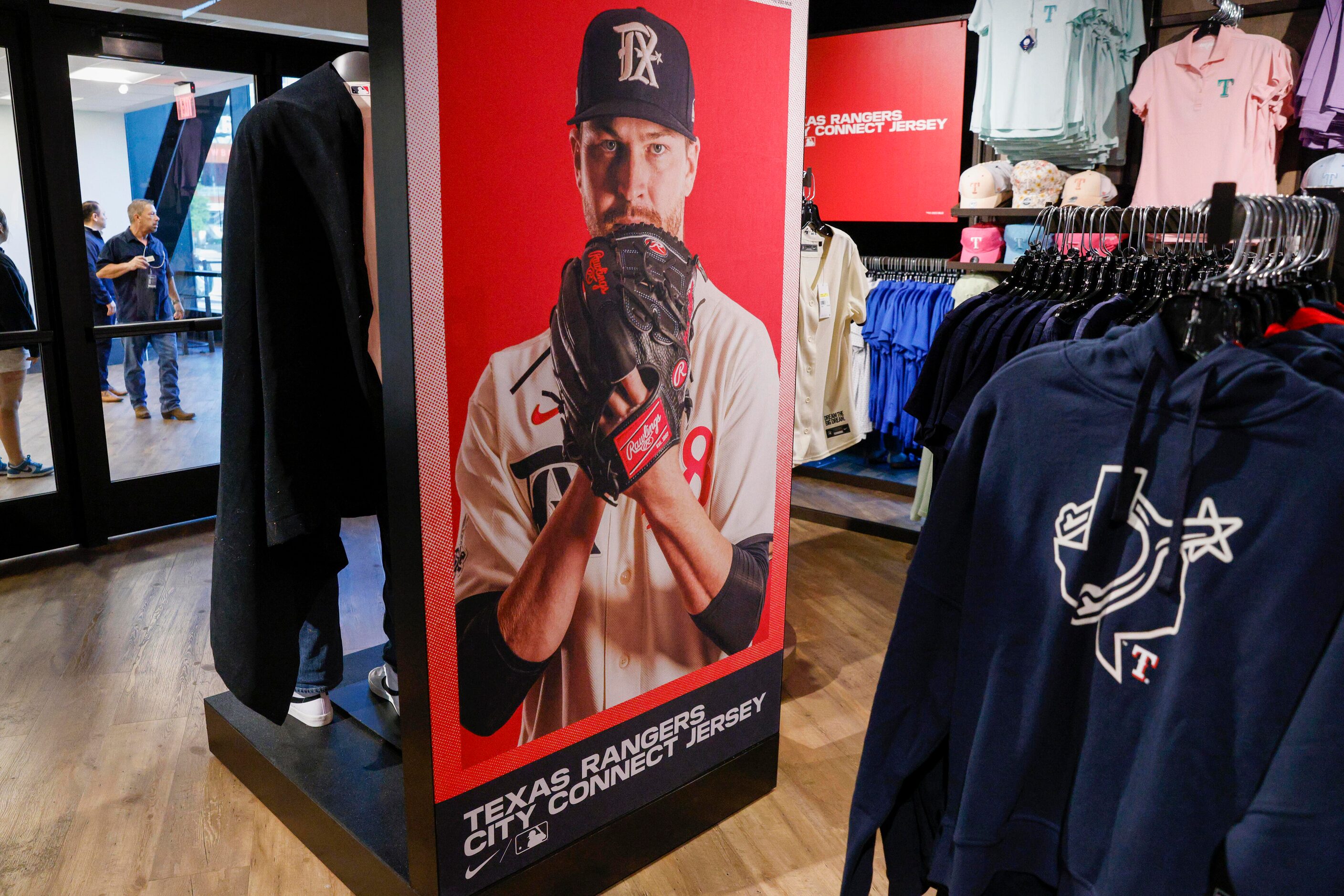 A display shows Texas Rangers starting pitcher Jacob deGrom (48) wearing the new City...