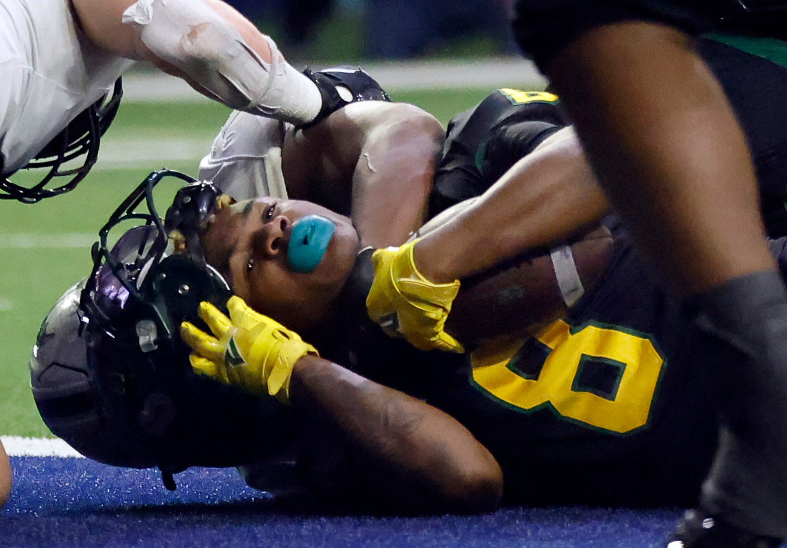 DeSoto running back Jaden Trawick (8) looses his helmet after scoring a fourth quarter...