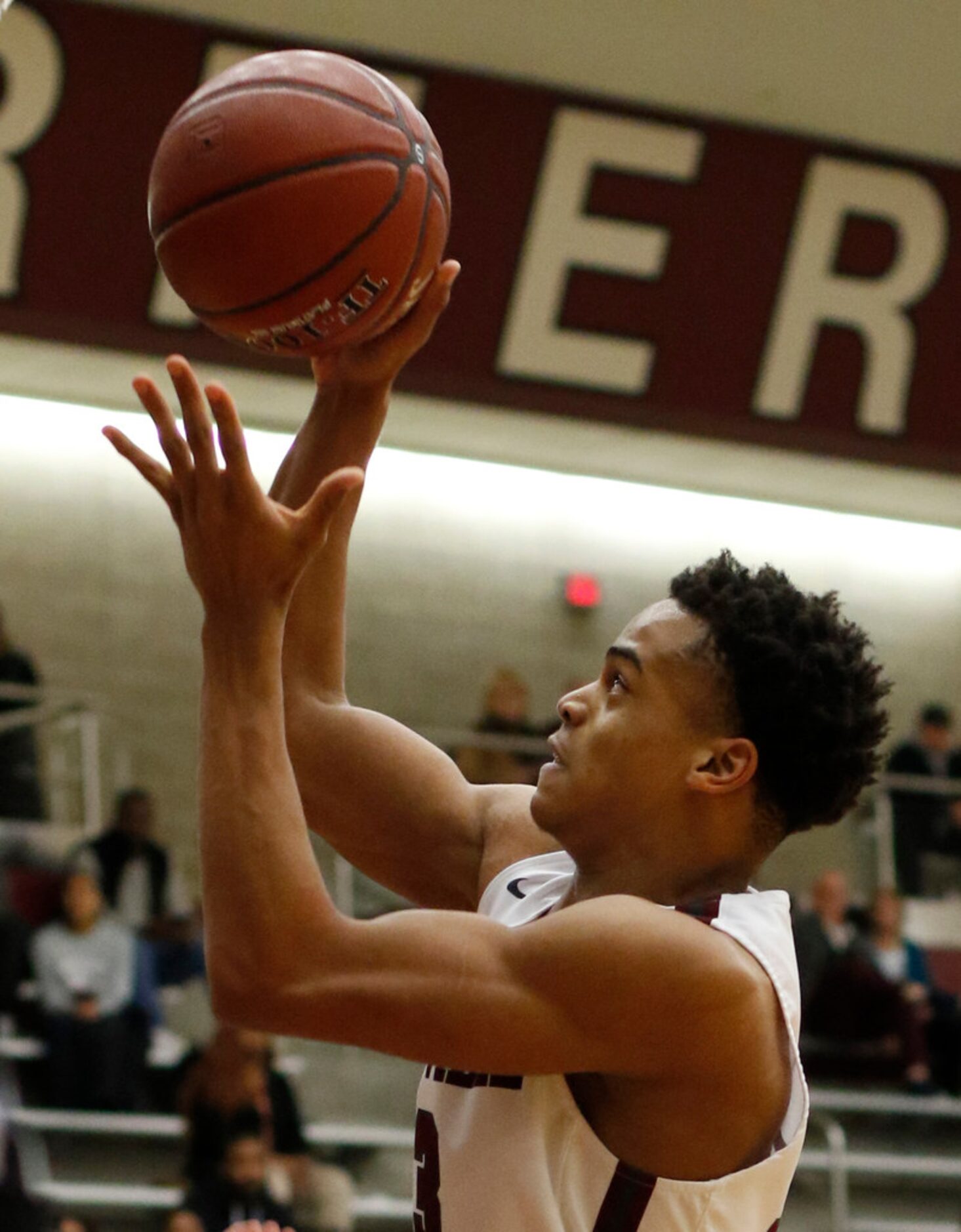 Lewisville's Tylan Dunn (13) scores a pair of his first half points during  game action...