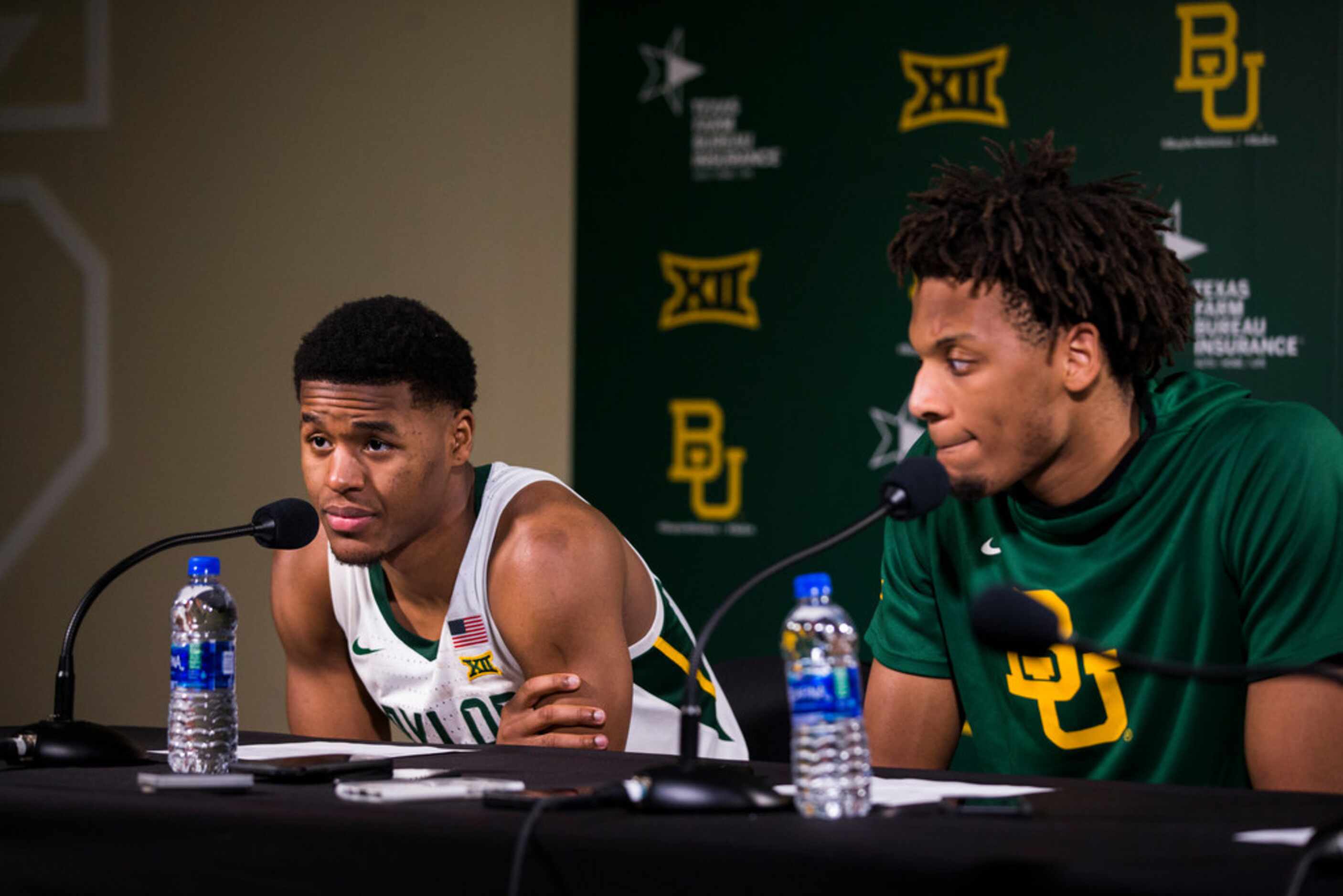 Baylor Bears guard Jared Butler (12) and forward Freddie Gillespie (33) speak to reporters...