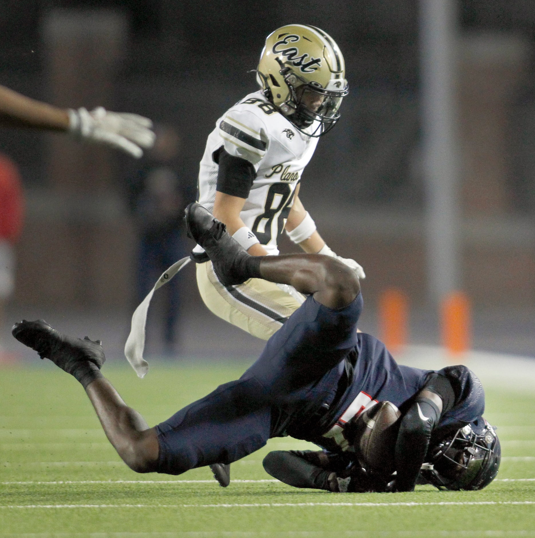 Allen defensive back Henson Amaechi (27) makes a diving interception of a Plano East pass...