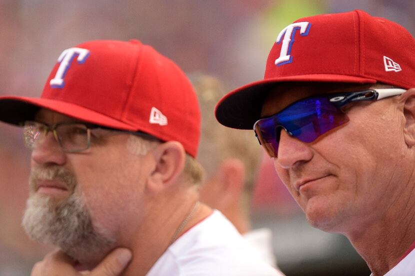 Texas Rangers pitching coach Doug Brocail, left, and manager Jeff Banister watch the action...