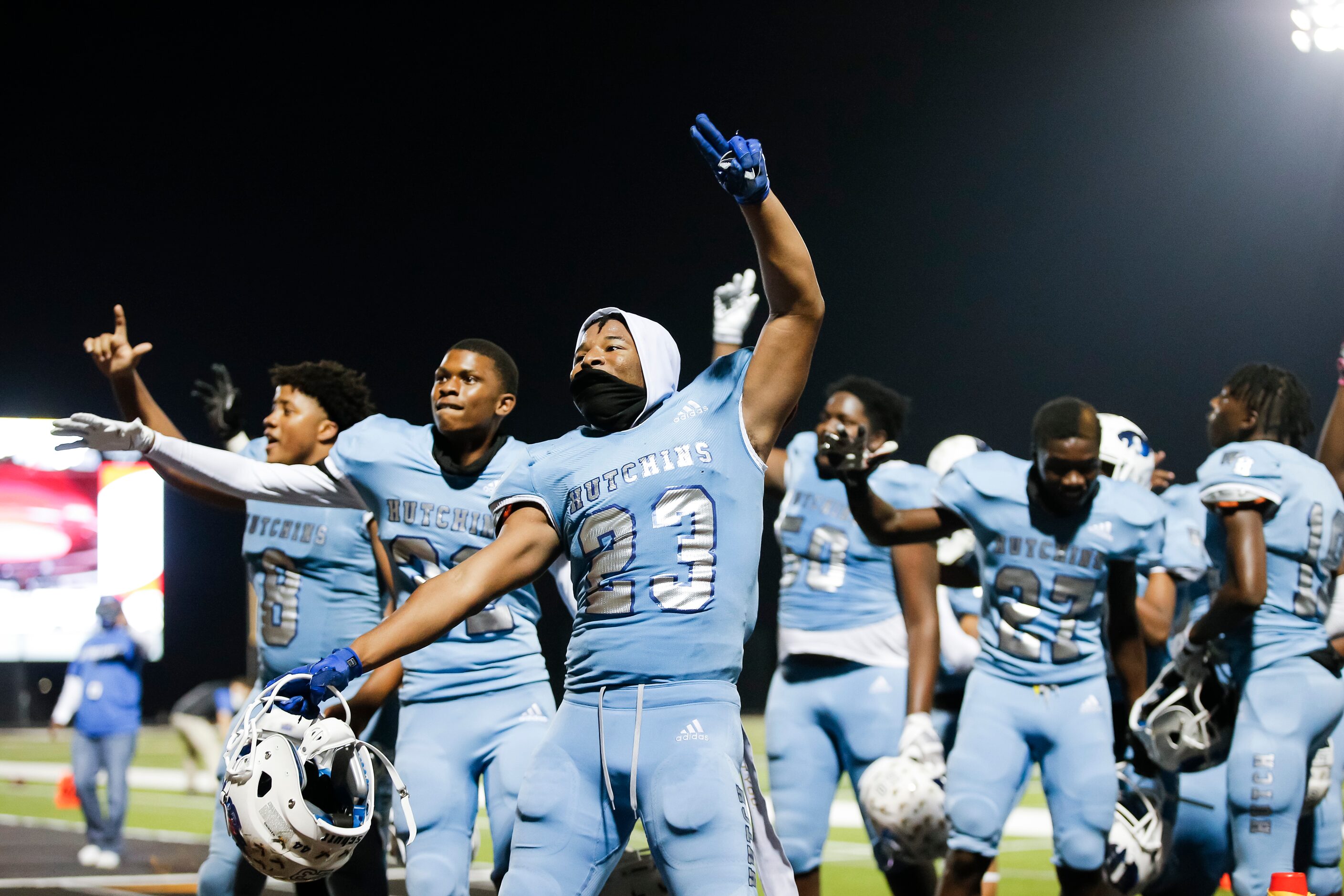 Wilmer-Hutchins senior linebacker Kendall Washington (23) and his teammates celebrate a...