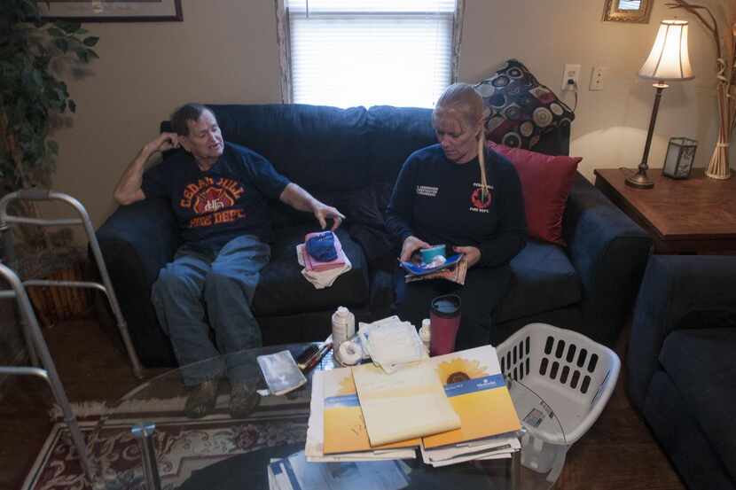 
Retired Cedar Hill firefighter Joe Mobley (left) and firefighter Traci Hemminger what to...