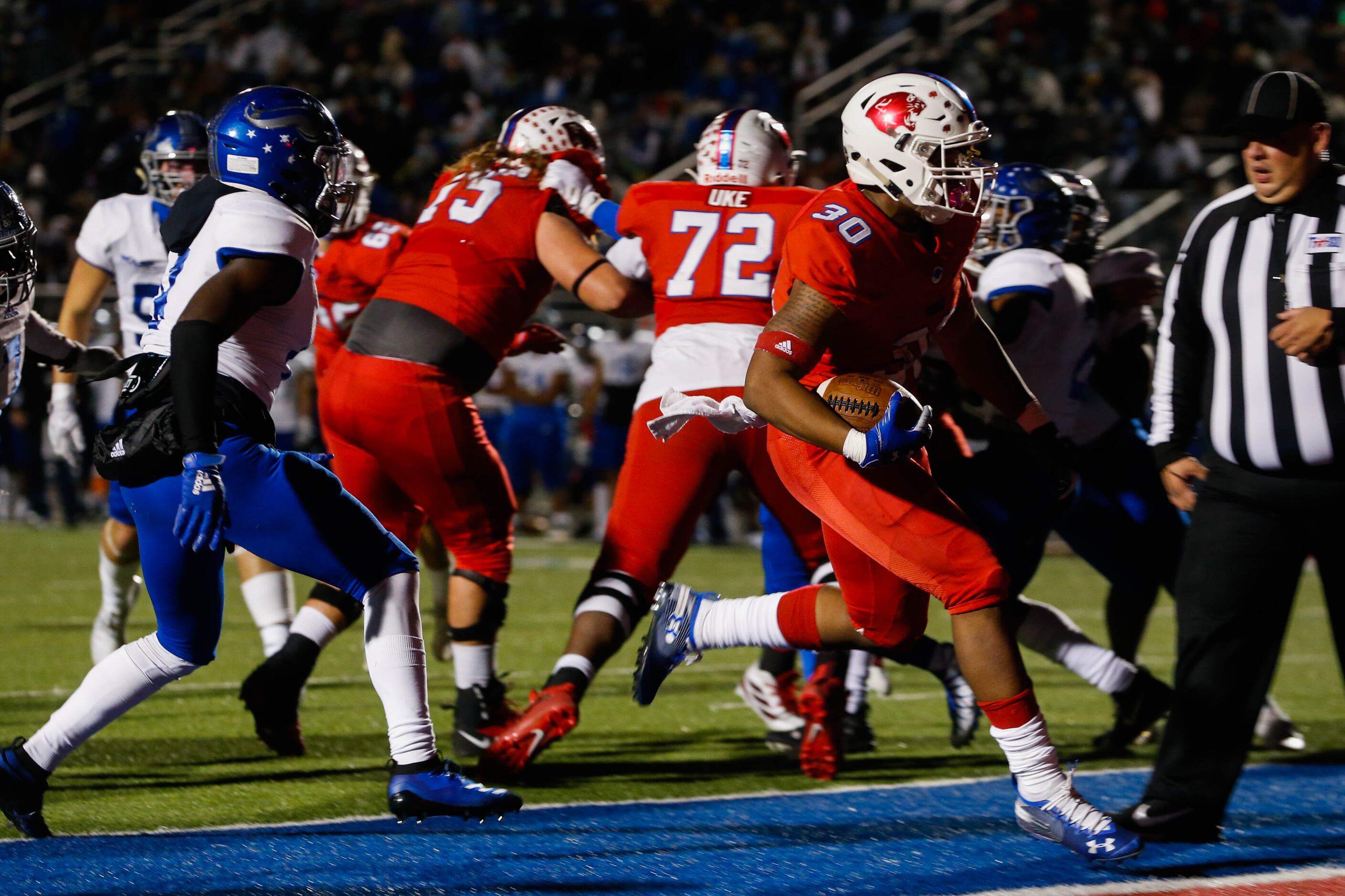 Parish Episcopal's Andrew Paul (30) runs in a touchdown during the first half of a TAPPS...