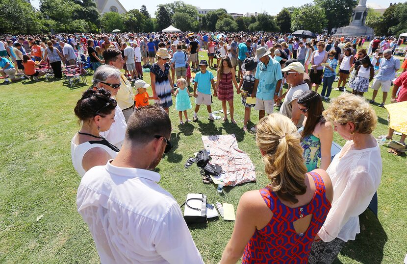 More than a thousand people join in prayer at Marion Square during a simultaneous Sunday...