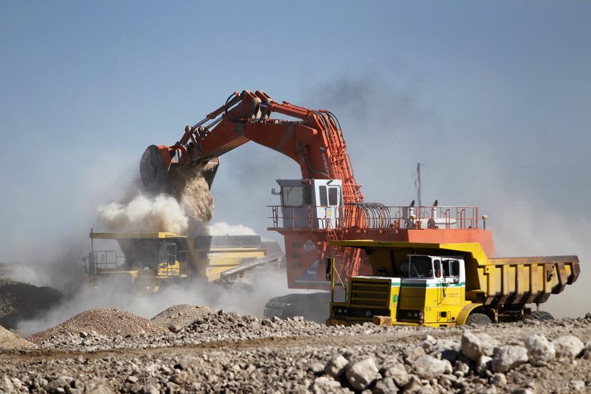 Heavy earth moving equipment clear soft caliche from the proposed federal waste disposal...