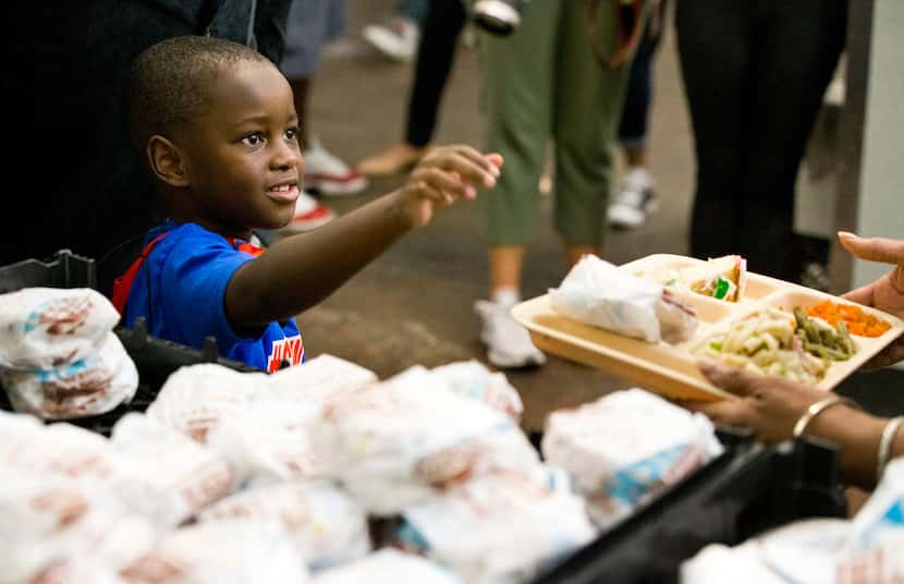 Austin Perine, 4, stopped in Dallas as part of his cross-country tour to help feed and raise...