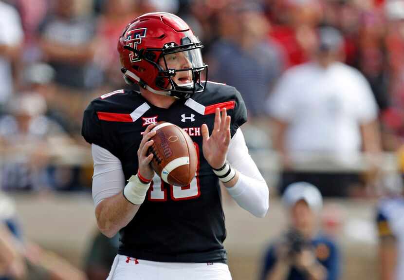 FILE - In this Saturday, Sept. 29, 2018, file photo, Texas Tech's Alan Bowman (10) drops...