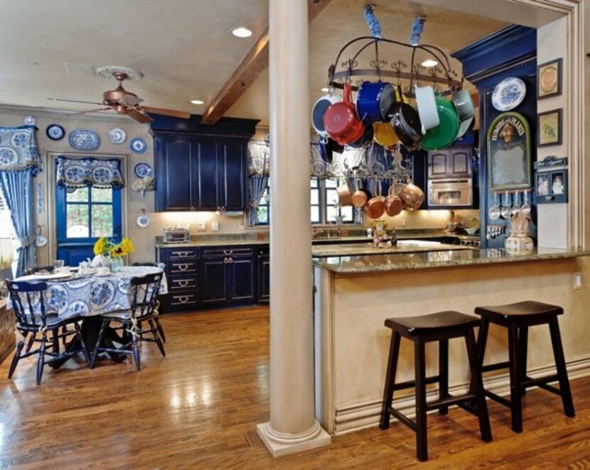 Another view of the kitchen, complete with two pot-racks.