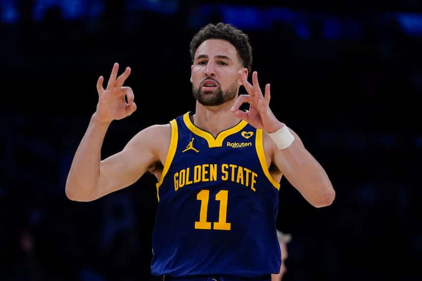 Golden State Warriors guard Klay Thompson gestures after making a 3-point basket against the...