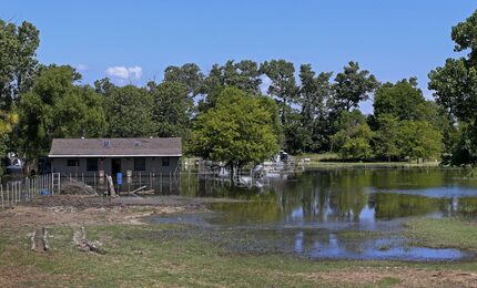 A house is flooded in an unincorporated area of southeastern Dallas County. 