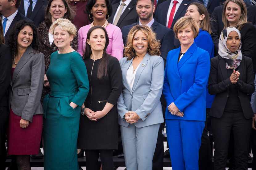 Democratic women in the front row at a photo for incoming House of Representatives freshmen,...