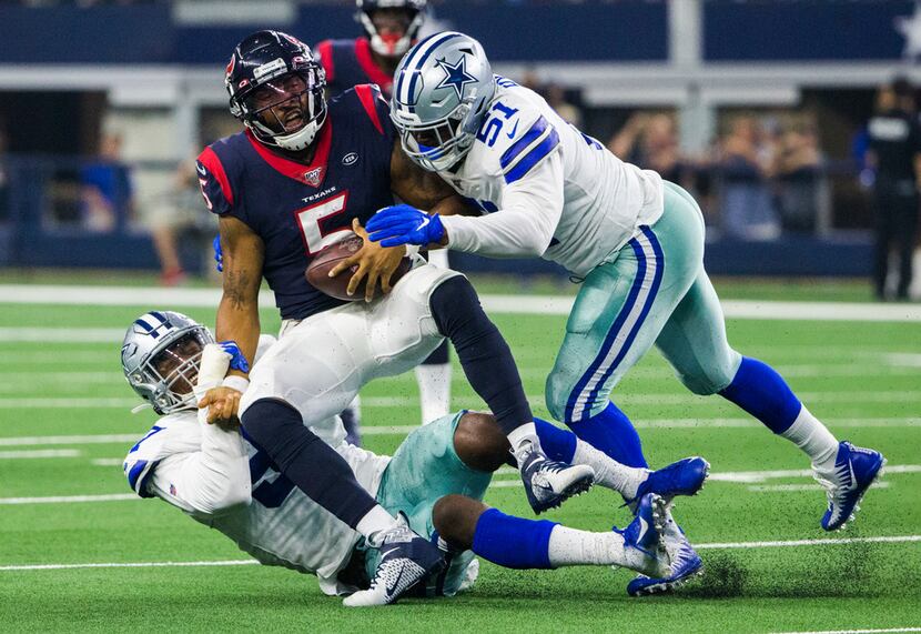 Dallas Cowboys defensive end Taco Charlton (97) and defensive end Kerry Hyder (51) sack...