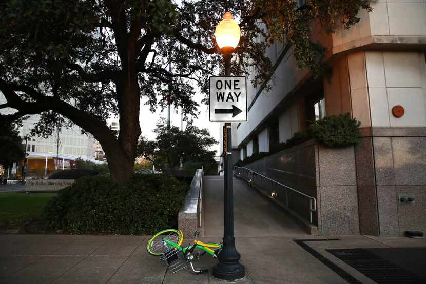 A LimeBike rental bike was abandoned along Houston Street in Dallas on Oct. 30, 2017. 