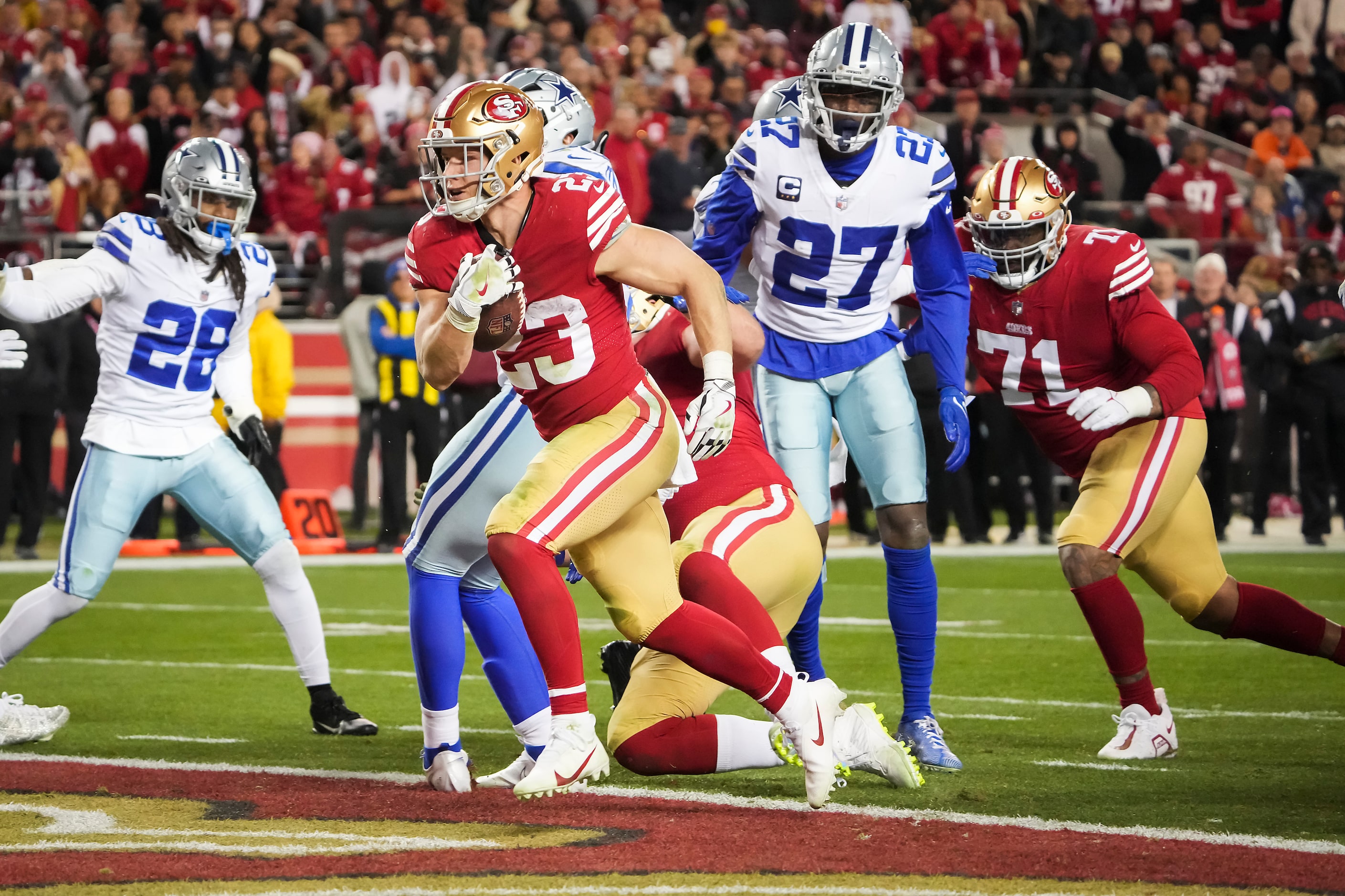 San Francisco 49ers running back Christian McCaffrey (23) scores on a 2-yard touchdown  run...