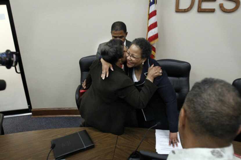 New School DeSoto School board Superintendent Dr. Kathy Augustine (right) got a hug from a...