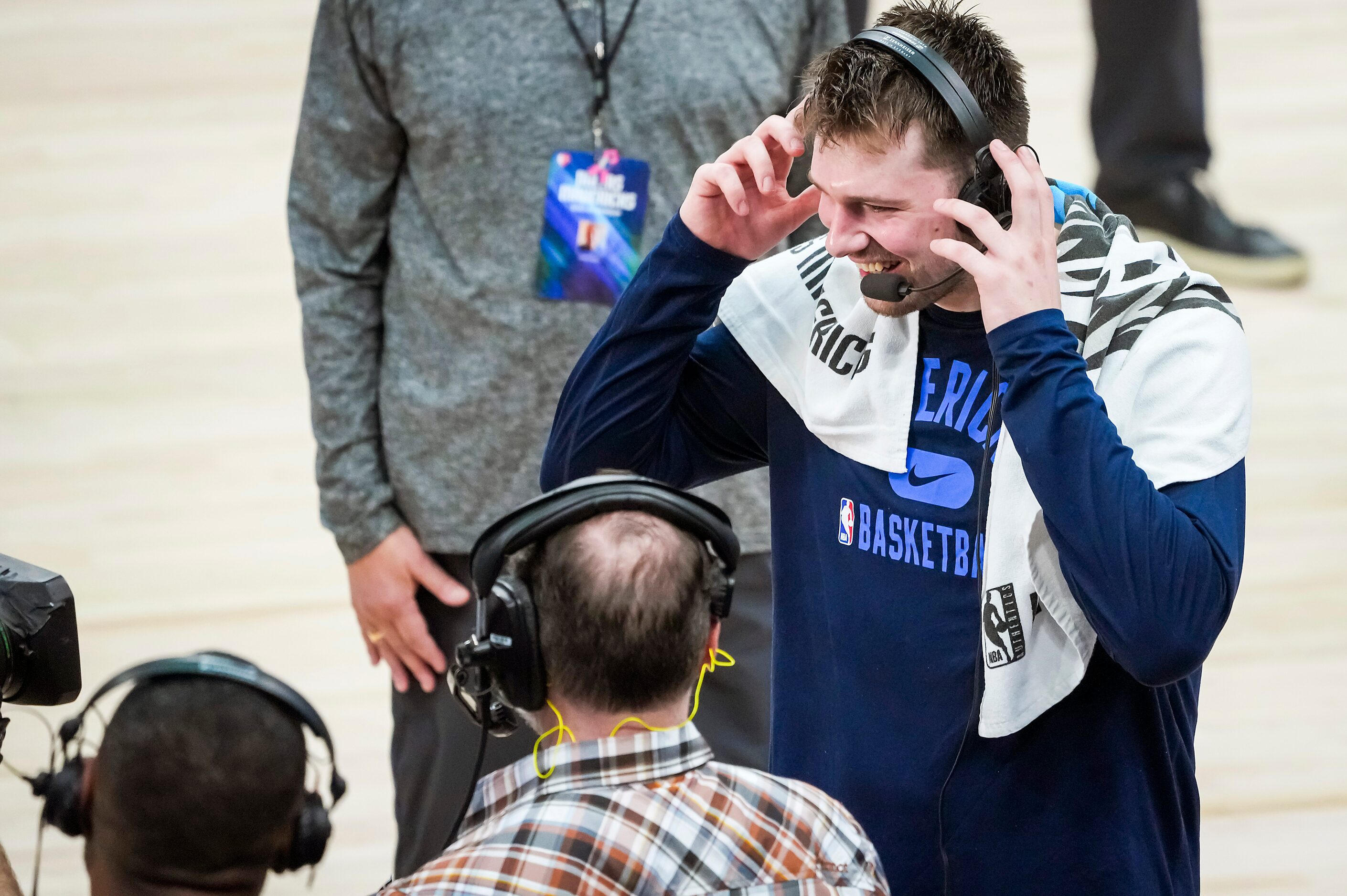 Dallas Mavericks guard Luka Doncic smiles as he does a broadcast interview after a victory...