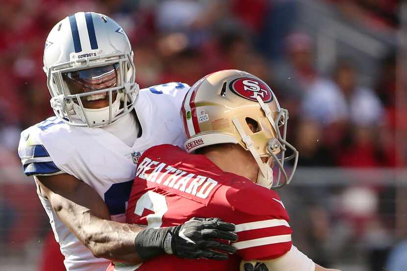 Dallas Cowboys free safety Byron Jones (31) puts pressure on San Francisco 49ers quarterback...