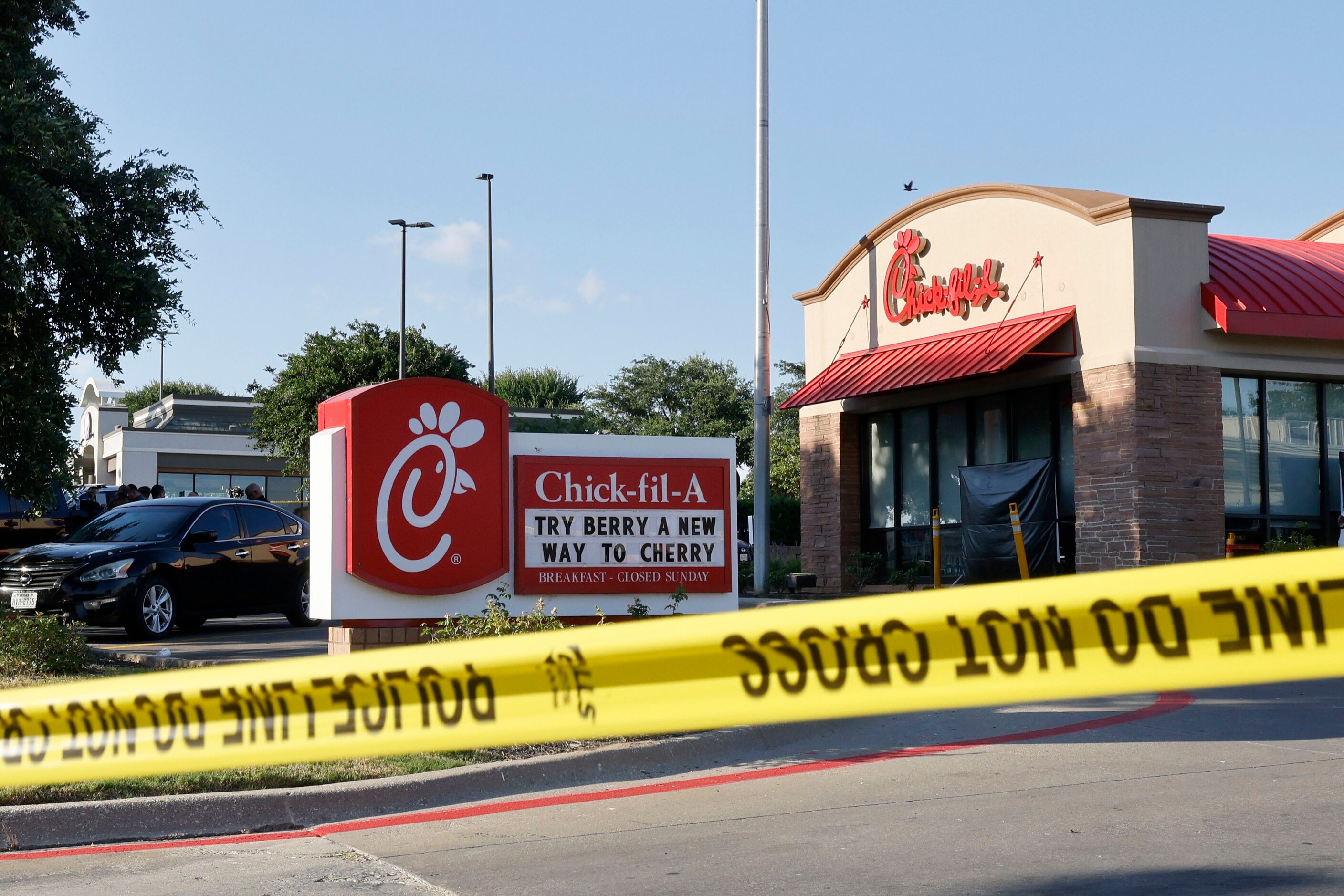 A yellow tape is seen in front of a Chick-fil-A after a shooting, Wednesday, June 26, 2024,...