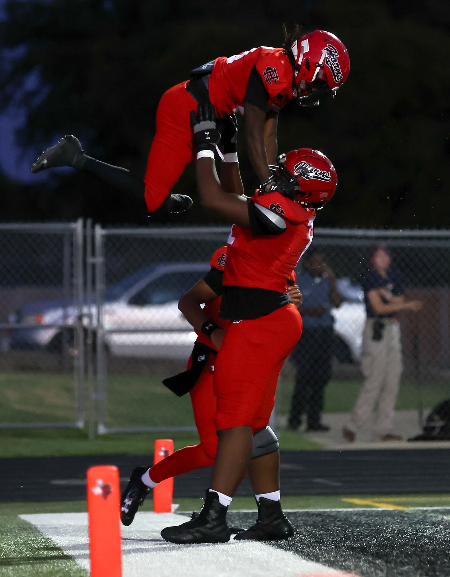 Cedar Hill running back Cededrick Castleberry celebrates with offensive guard Kelton Elie...