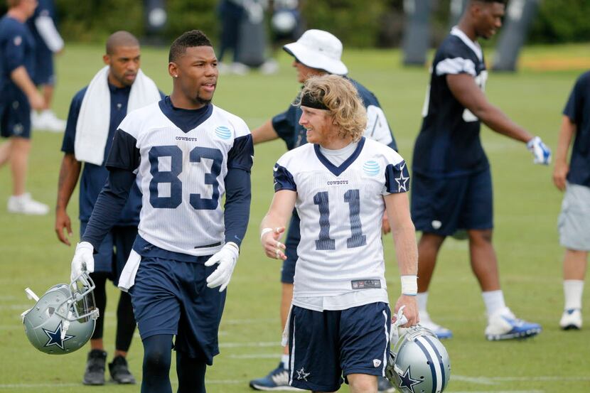 Dallas Cowboys wide receiver Terrance Williams (83) and wide receiver Cole Beasley (11) walk...