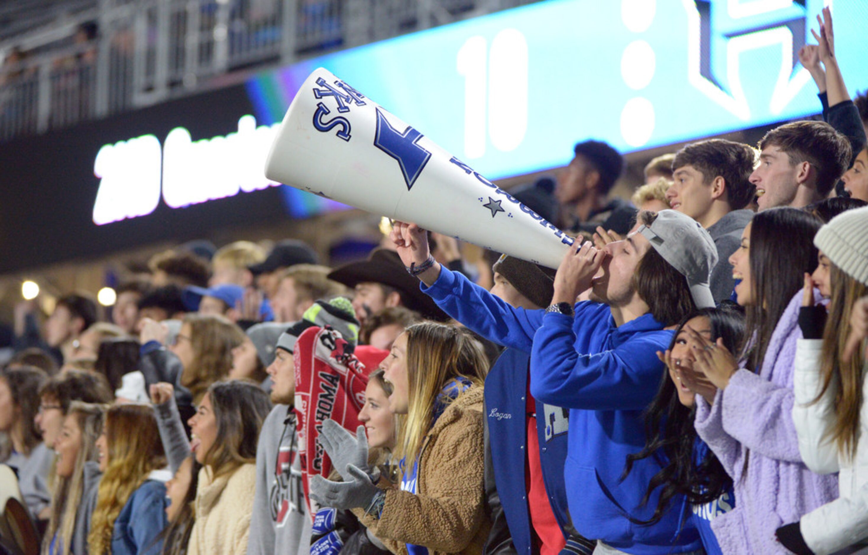 Hebron students cheer in the first half of a Class 6A Division II bi-district high school...