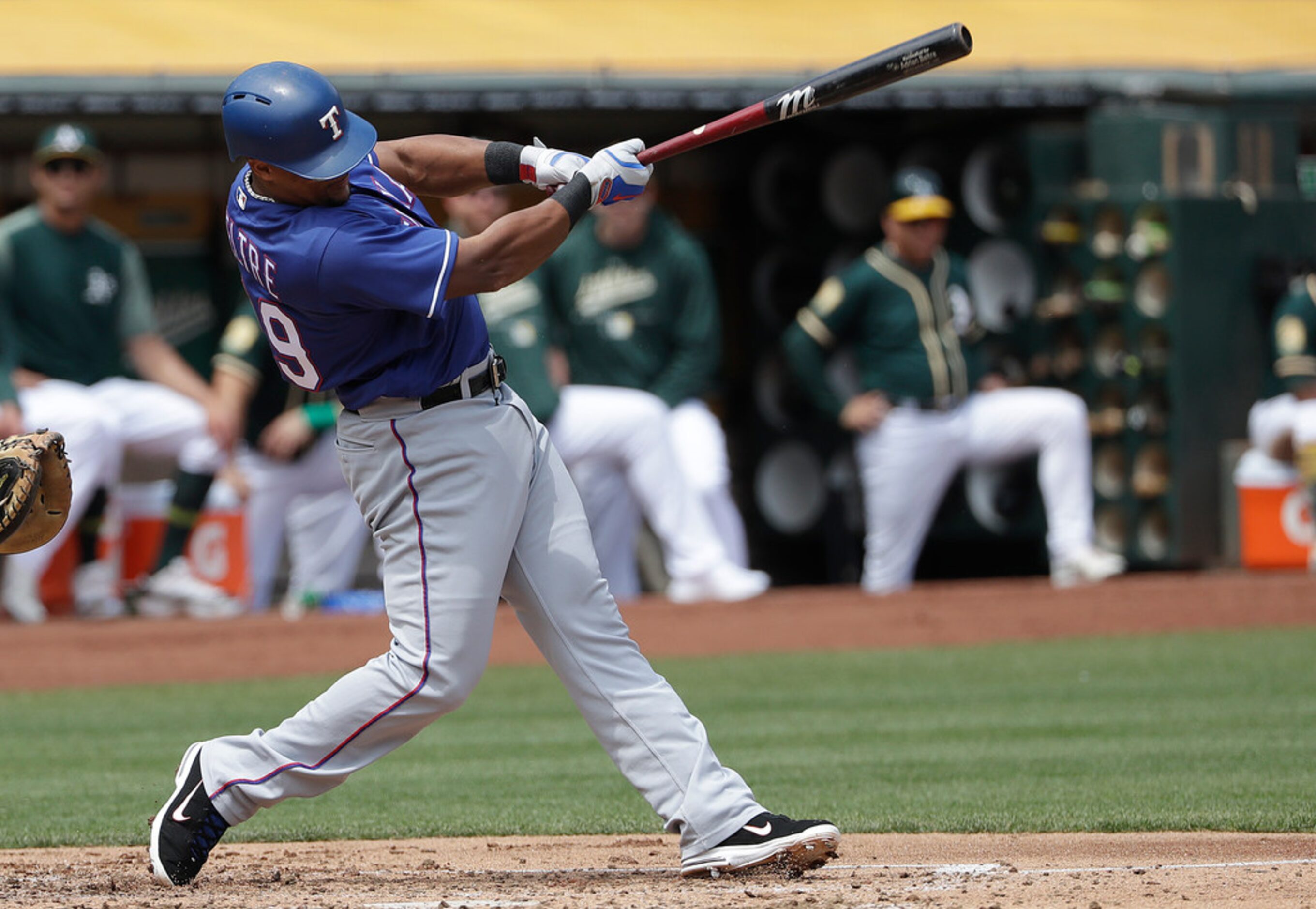 Texas Rangers' Adrian Beltre hits an RBI-single against the Oakland Athletics during the...