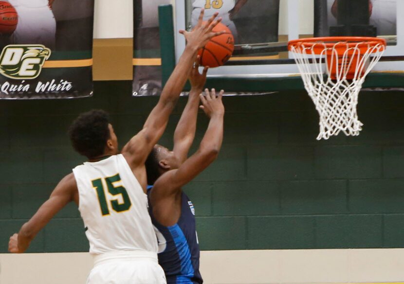 DeSoto's Feron Hunt (15) skies to block the shot of Allen's Jaylon Scott (20) during first...