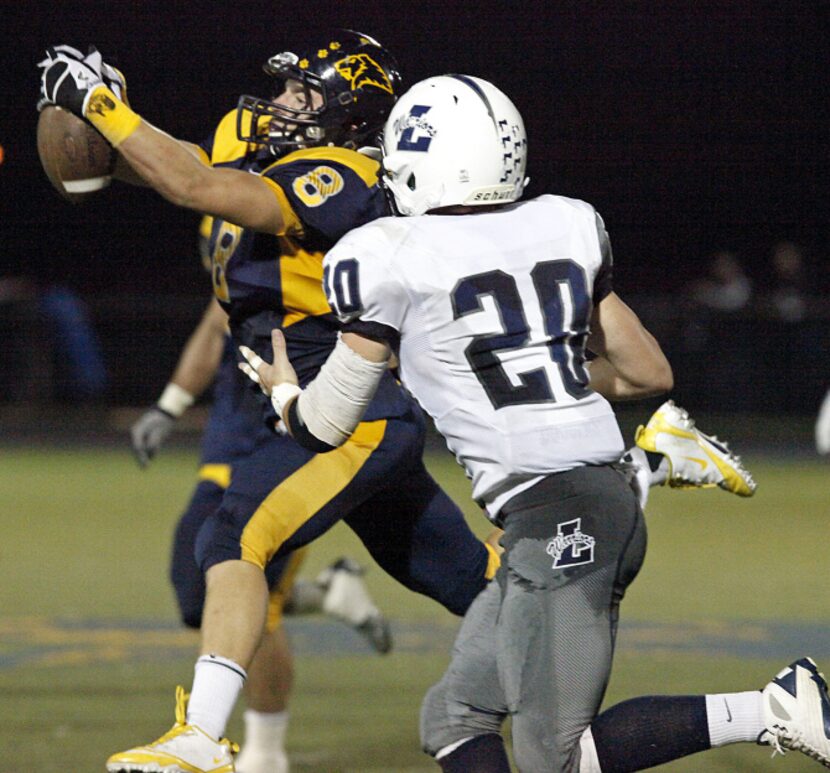 Prestonwood Christian Academy safety Austin Tankersley (8) leaps to intercept this pass...