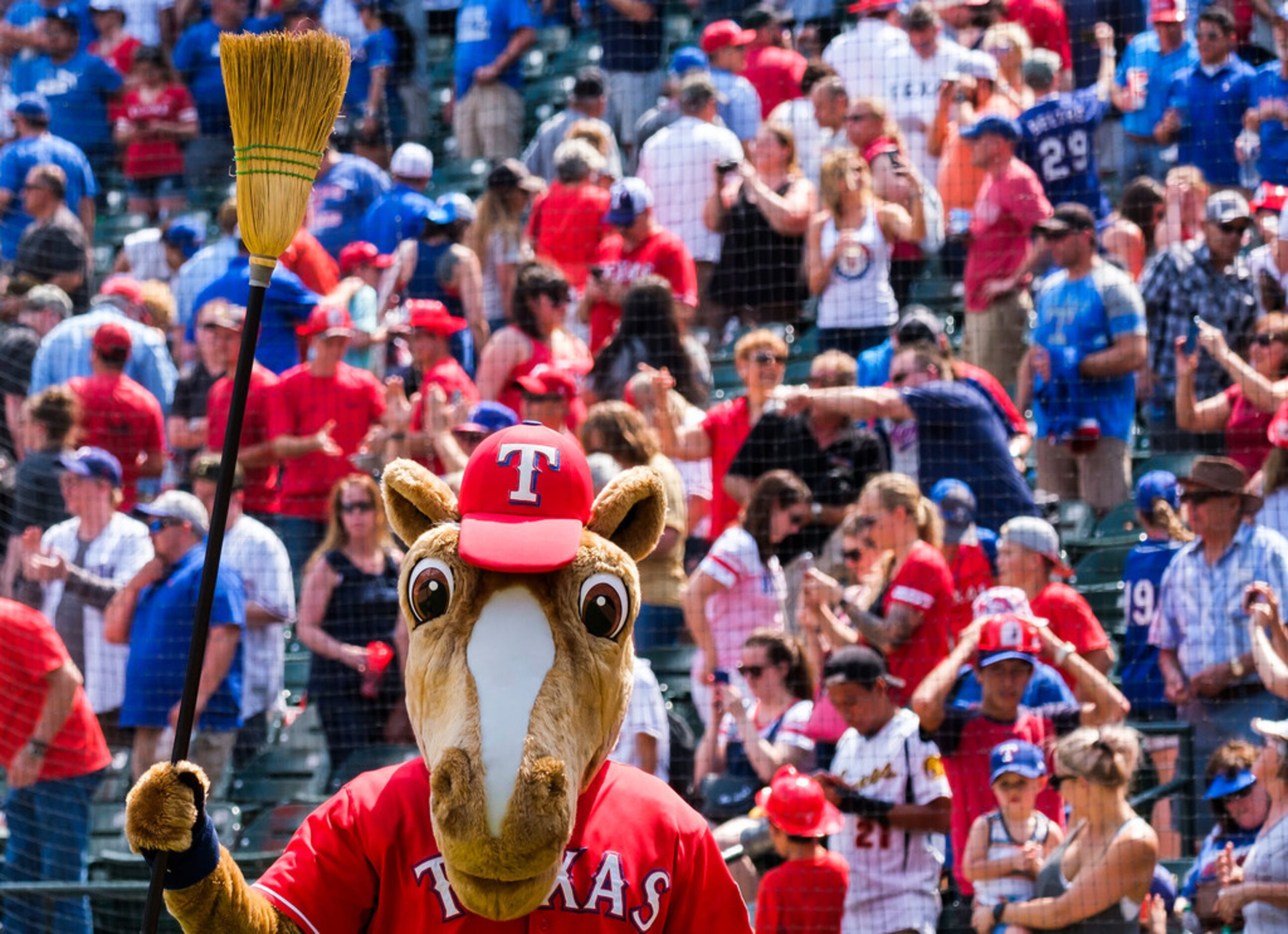 The Rangers Captain mascot waves a broom after the Rangers series sweep of the Seattle...