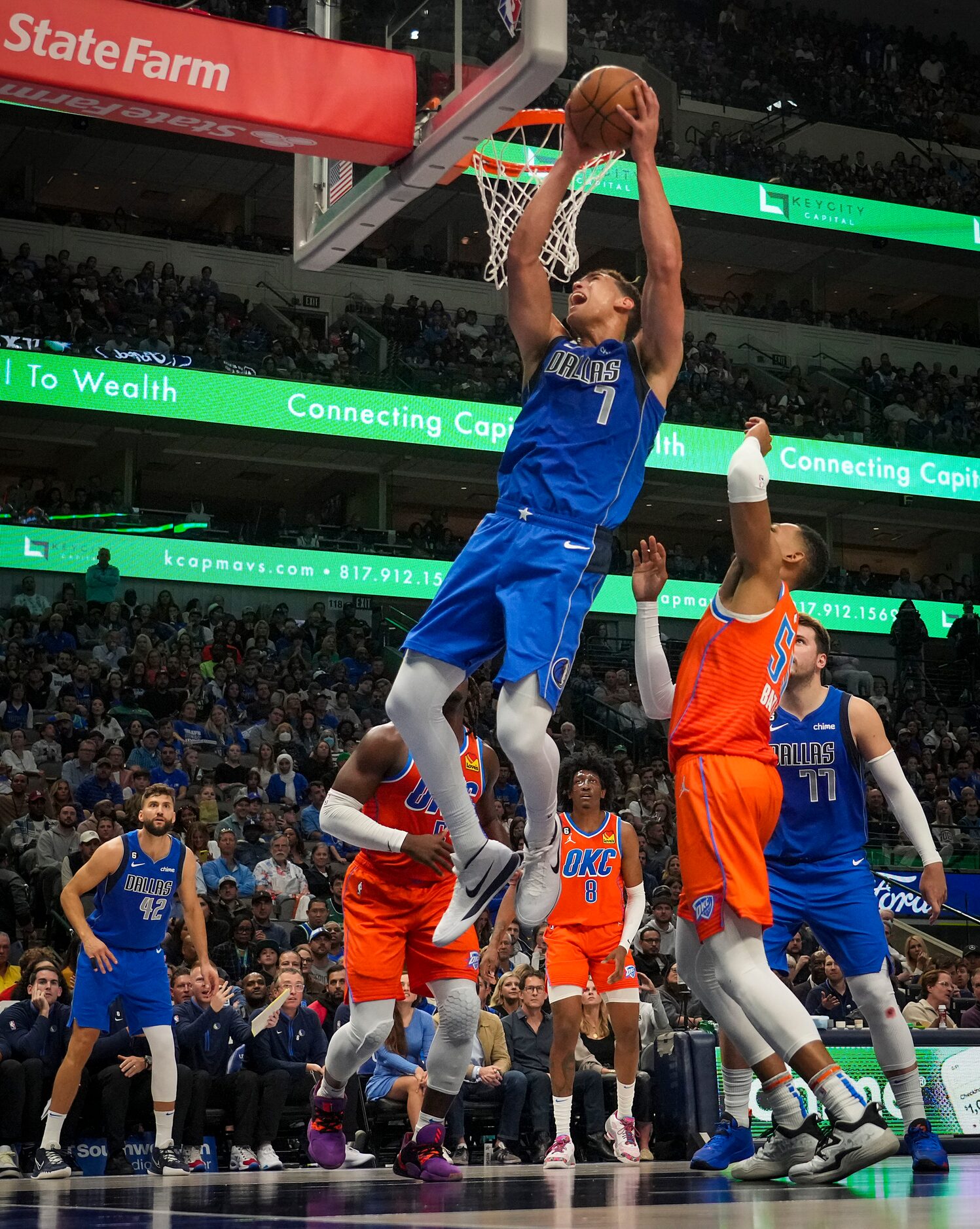 Dallas Mavericks center Dwight Powell (7) drives  during the first half of an NBA basketball...