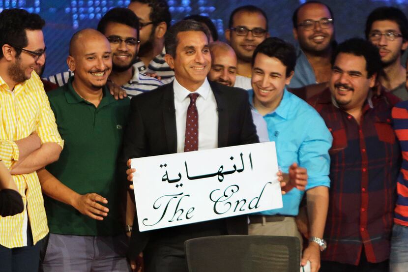 Egyptian satirist Bassem Youssef, who is known as Egypts Jon Stewart," poses with his team...